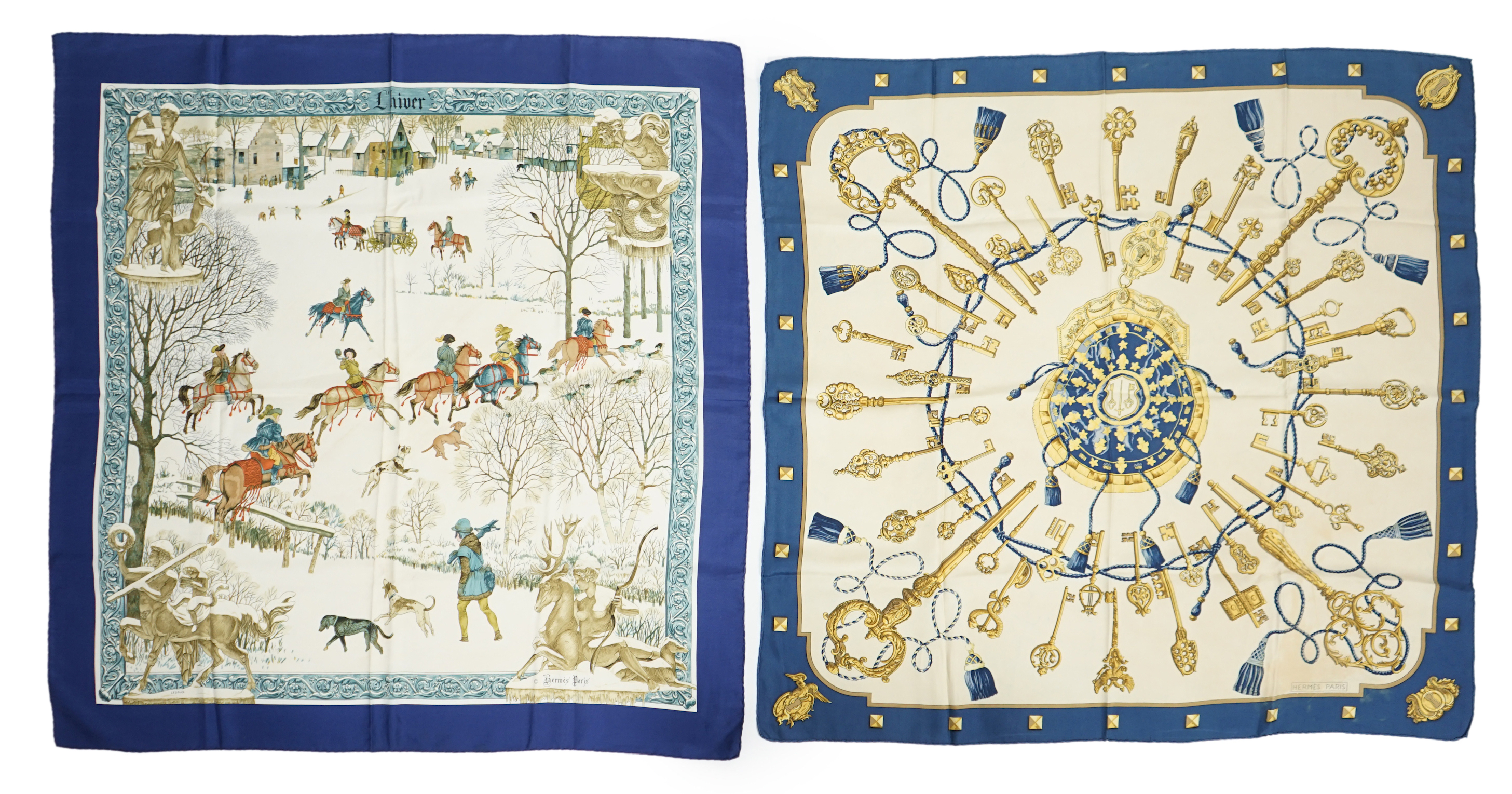 A Hermès 'Les Cles Key' blue border multicolour silk scarf and a Hermès Lhiver blue, white and gold silk scarf, both 90cm x 90cm